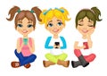 Three cute little girls sitting on floor using their smartphones smiling happy