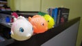 Three cute, plastic, little fish toy