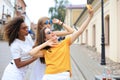 Three cute young girls friends having fun together, taking a selfie at the city Royalty Free Stock Photo