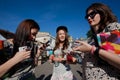 Three cute young women with wine glasses