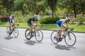 Three cyclists competing