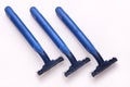 Three dark blue disposable plastic shavers Royalty Free Stock Photo