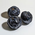 Three dark dried figs on a white background Royalty Free Stock Photo