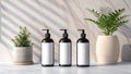 Three dark pump bottles with blank labels and plants on a table Royalty Free Stock Photo