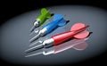 Three darts arrows in the spot of light Royalty Free Stock Photo