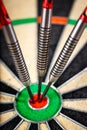 Three darts in bull`s eye Royalty Free Stock Photo