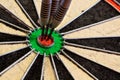 Three Darts in bullseye