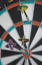 Three darts in dartboard