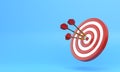 Three darts hitting a red target on the center on blue background with copy space
