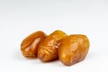 Close-up of dates against a white background. Ramadan concept. Royalty Free Stock Photo