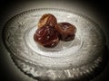 three dates on a small plate