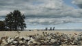 Three deck chairs on a rocky promontory under a cloudy sky Royalty Free Stock Photo