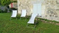 Three deckchairs in peaceful garden