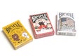 Three decks of the American Flag, Line Friends and Maneki Neko theme poker cards made by Bicycle United States Playing Cards Compa