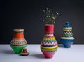 Three decorated pottery vases with small flowers with harsh shad Royalty Free Stock Photo