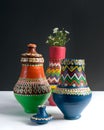 Three decorated pottery vases with small flowers Royalty Free Stock Photo