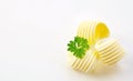 Three decorative elegant curls of fresh butter Royalty Free Stock Photo