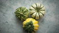 Three decorative mini pumpkins on a rustic stone background. Colorful autumn scene Royalty Free Stock Photo