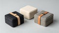 Three decorative square boxes with leather straps and buttons. Royalty Free Stock Photo