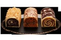 Three decorative Swiss roll cakes displayed on an ornate silver platter. Each roll features a distinct design: Royalty Free Stock Photo