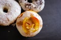 Three delicious Donuts on a black background Royalty Free Stock Photo