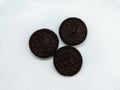 Three delicious looking chocolate biscuits on a white background Royalty Free Stock Photo
