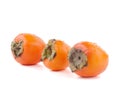 Three delicious persimmons Royalty Free Stock Photo