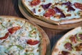 Three Delicious Pizzas With Different Toppings Royalty Free Stock Photo