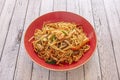 Three delight stir fry noodles with vegetable strips, minced chicken