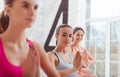 Three delighted women enjoying group yoga classes