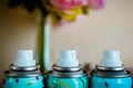 Three deodorant nozzles close up. Colorful metall bottles with dry deodorant Royalty Free Stock Photo