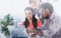 Three designers working together on a laptop Royalty Free Stock Photo