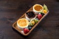 Three desserts in ramekins. Creme brulee assortment. Fresh strawberries, blueberries and physalis Royalty Free Stock Photo