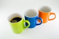 Three diagonal mugs with coffee mug in the center