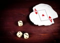 Three dice near playing card, poker game texas Royalty Free Stock Photo