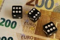 Three dice three sixes on euro banknotes. Royalty Free Stock Photo