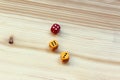 Three dices on wooden background. Royalty Free Stock Photo