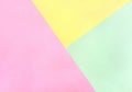 Three different color paper sheets  pink, green, yellow  with paper geometric pattern background. Top view, flat lay Royalty Free Stock Photo