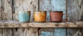 Three Different Colored Coffee Mugs on Shelf Royalty Free Stock Photo