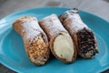 Three different delicious typical Sicilian cannoli filled with ricotta chse cream