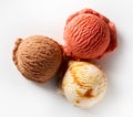 Three different flavored scoops of ice cream