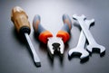 Three Different Hand Tools on a Gray Background Royalty Free Stock Photo