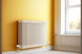 three different heating radiator on beige wall near window