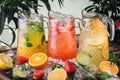 Three different jugs of lemodane refreshing drink