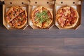 Three different kind of pizzas in delivery boxes Royalty Free Stock Photo