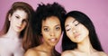 Three different nation girls with diversuty in skin, hair. Asian, scandinavian, african american cheerful emotional