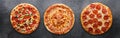 Three different pizzas in panoramic composition Royalty Free Stock Photo