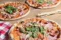 Three different pizzas on wooden table. Freshly baked traditional Italian Pizza over wooden background Royalty Free Stock Photo