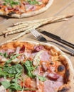 Three different pizzas on wooden table. Freshly baked traditional Italian Pizza over wooden background Royalty Free Stock Photo
