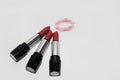 Three different shades of Mary Kay lipstick are open on a white background and next to it is a lipstick print and the inscription